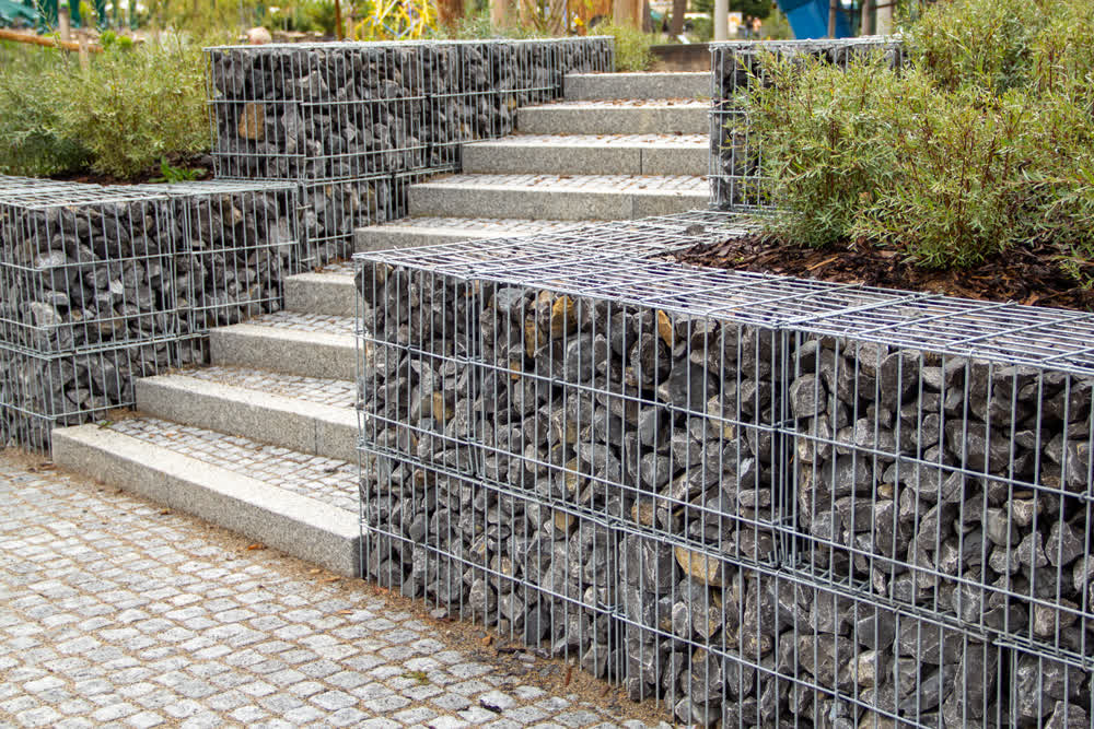 Gabion retaining walls tiered beside tiled steps
